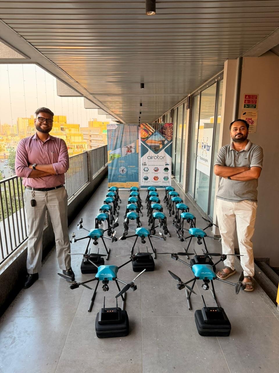 AiRotor Labs team with a batch of 25 industrial drones lined up for delivery
